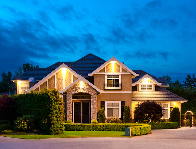 A house during dusk with lights on